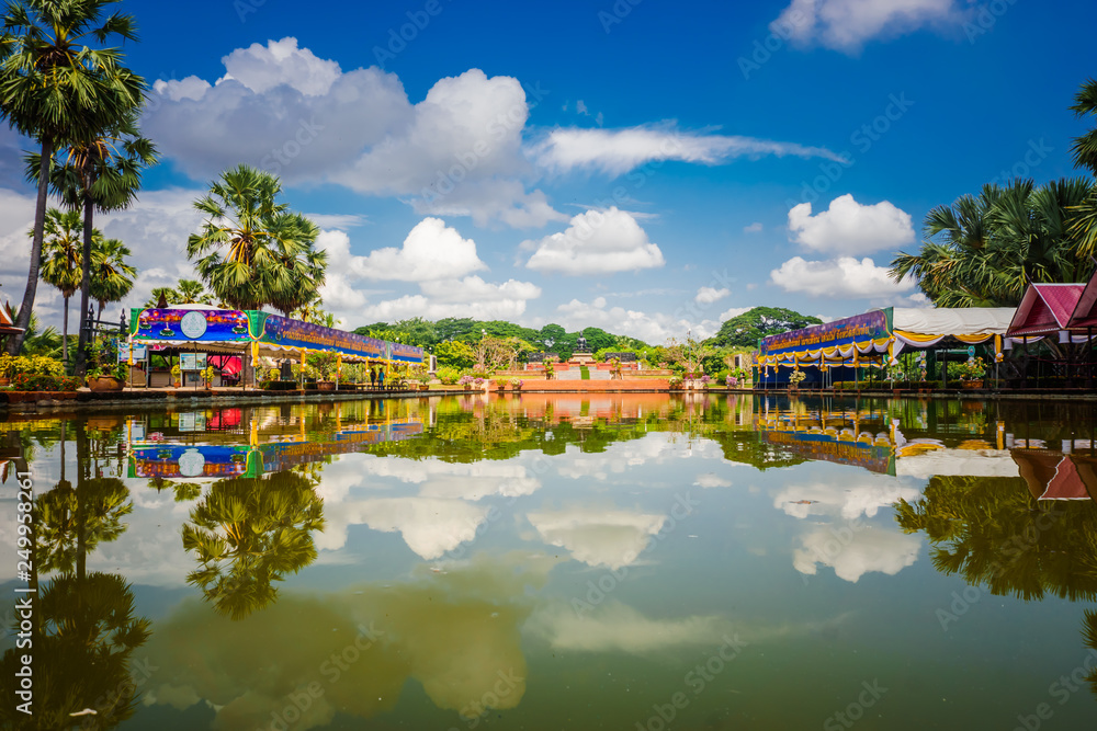 The base of the chedi is surrounded by the statues of 24 elephants, in Sukhotai national park, Thailand