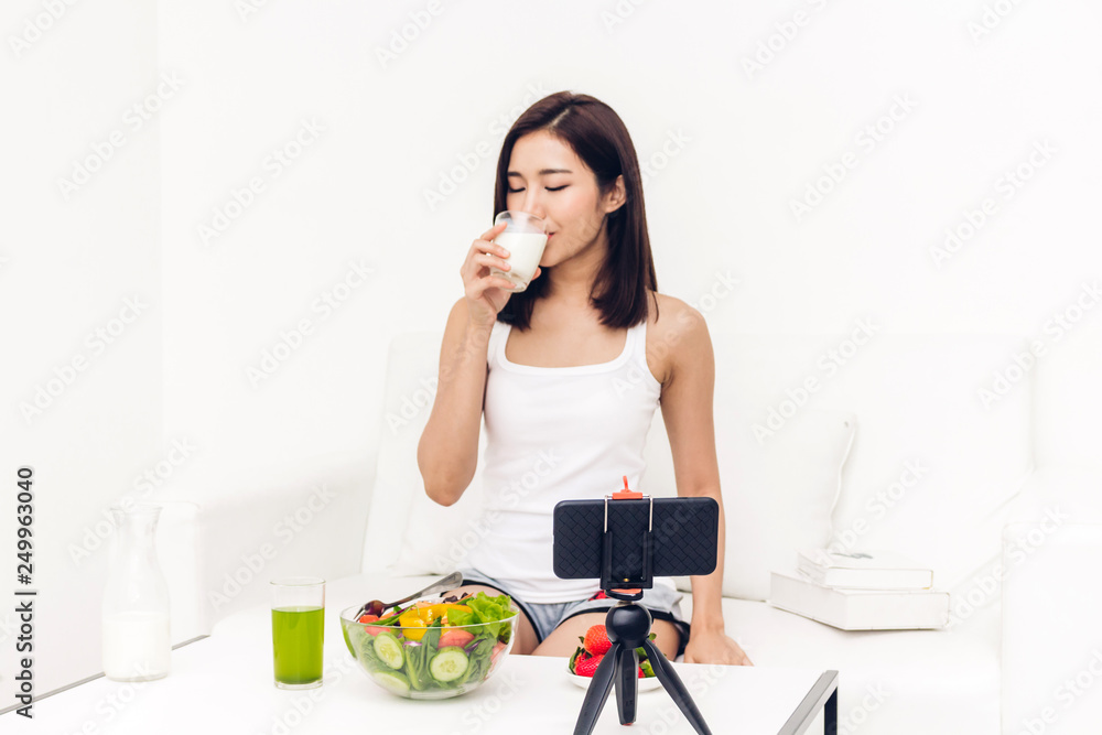 Woman hands holding glass of fresh milk Woman hands holding glass of fresh milk