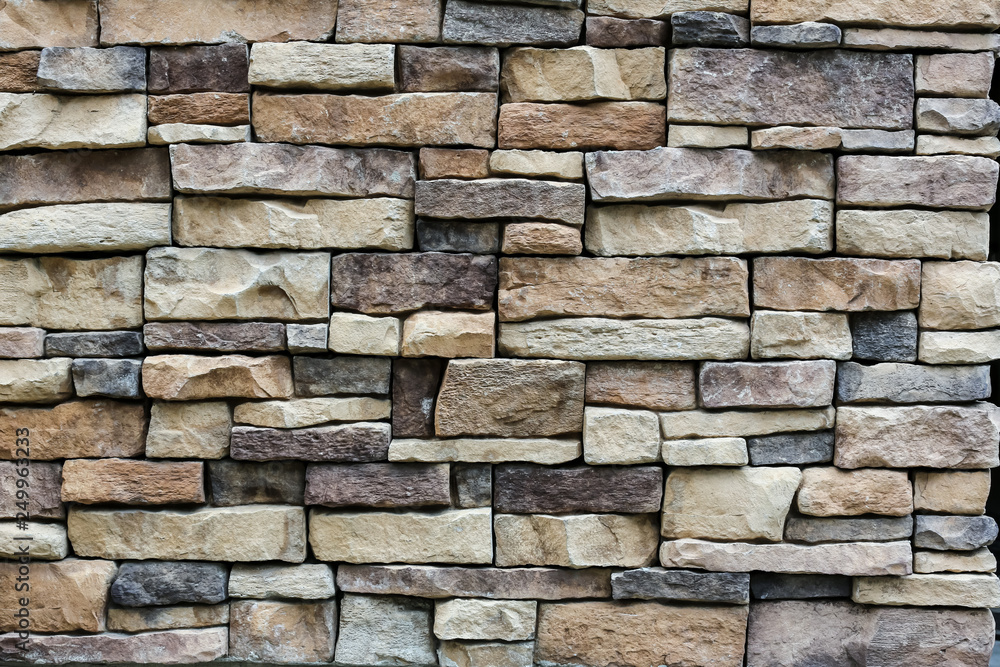 the stone wall texture background natural color.Background of stone