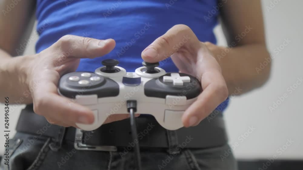 man concept playing gamepad hands video console on tv. Hand hold new joystick playing video console on tv. Gamer play game with gamepad controller. Gaming man lifestyle holding simulator joypad man concept playing gamepad hands video console on tv. Hand hold new joystick playing video console on tv. Gamer play game with gamepad controller. Gaming man lifestyle holding simulator joypad