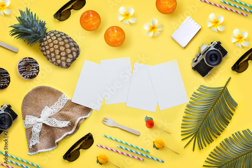 Flat layout of summer travel vacation objects on yellow background. Text space image.