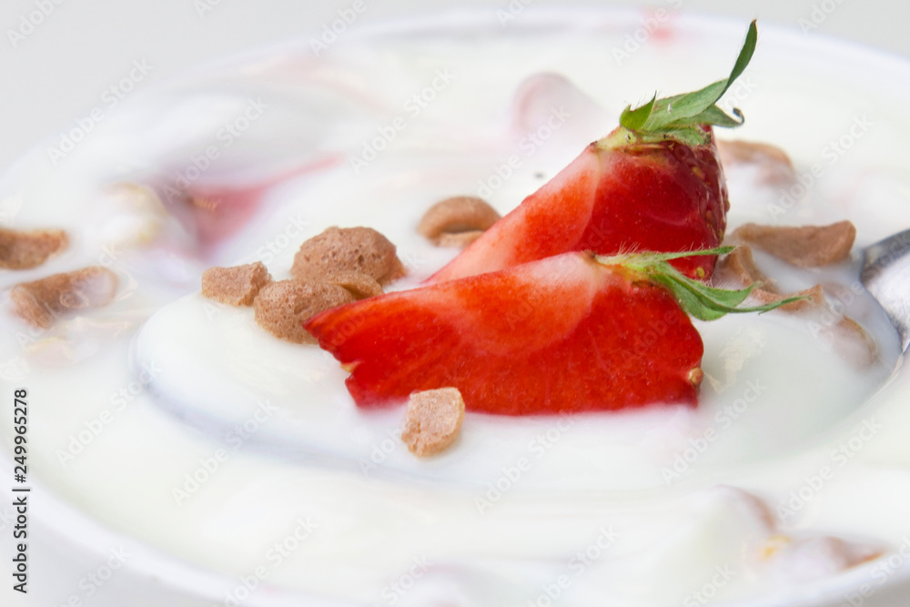 strawberry with yogurt and mint in bowl on wood background