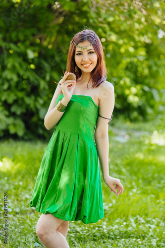 Beautiful young asian woman with fresh kiwi