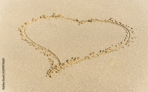 Heart Drawn into the Sand on a Beach on a Sunny Day