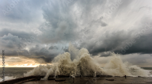 Storm waves over a pier in the Adler, Sochi