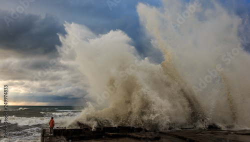 Storm waves over a pier in the Adler, Sochi