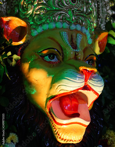 Closeup view of Hindu god Narasimha,avatar of Vishnu decoration during festival in a temple photo