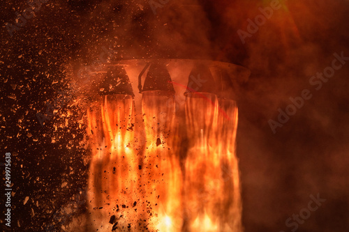 Vászonkép Rocket engines and fire duting the missile launch at night, close up conceptual image