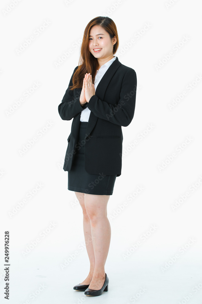 Asian young businesswoman showing greeting in Thai traditional Sawasdee. Asian young businesswoman showing greeting in Thai traditional Sawasdee.