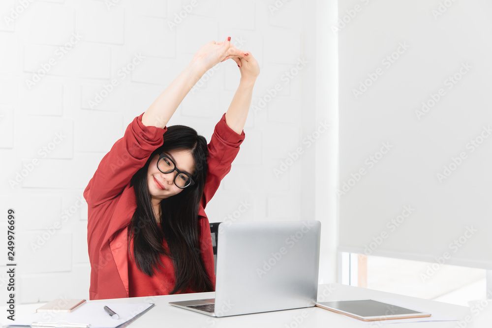 Asian businesswoman being relaxed from sitting in the office Asian businesswoman being relaxed from sitting in the office