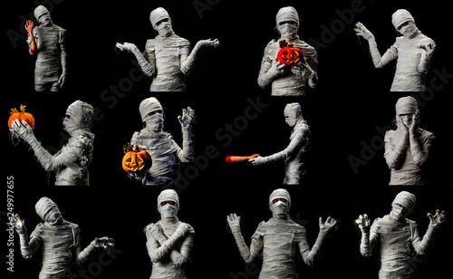 Fotografie, Obraz Set of studio shot portrait of young man in costume dressed as cosplay of scary mummy pose in several manners on black background