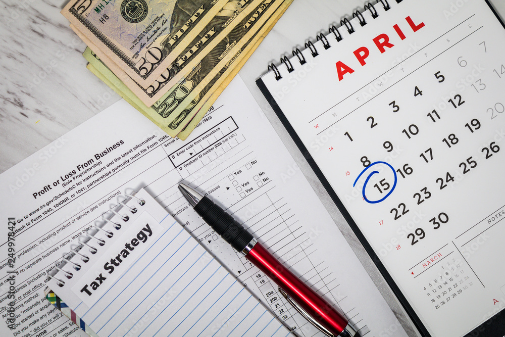 Tax Strategy still life business finance concept with calculator and tax forms, flat lay Tax Strategy still life business finance concept with calculator and tax forms, flat lay