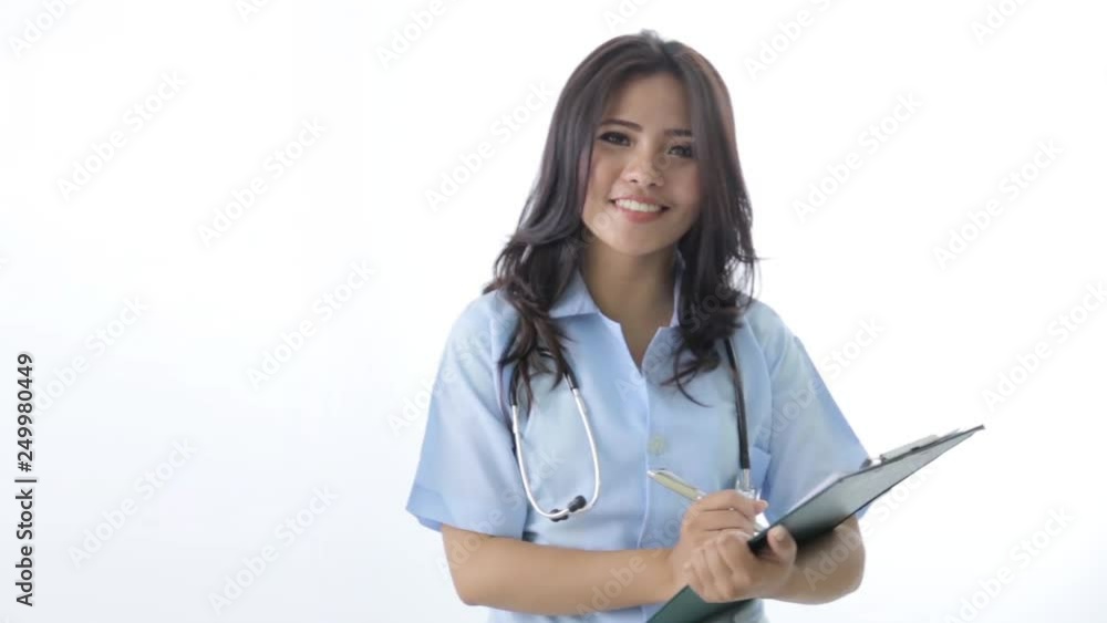 happy female nurse smiling to the camera over white background happy female nurse smiling to the camera over white background