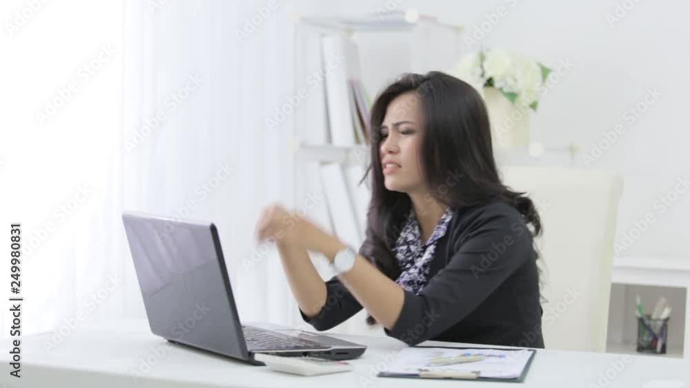 unhappy businesswoman while working in her office unhappy businesswoman while working in her office