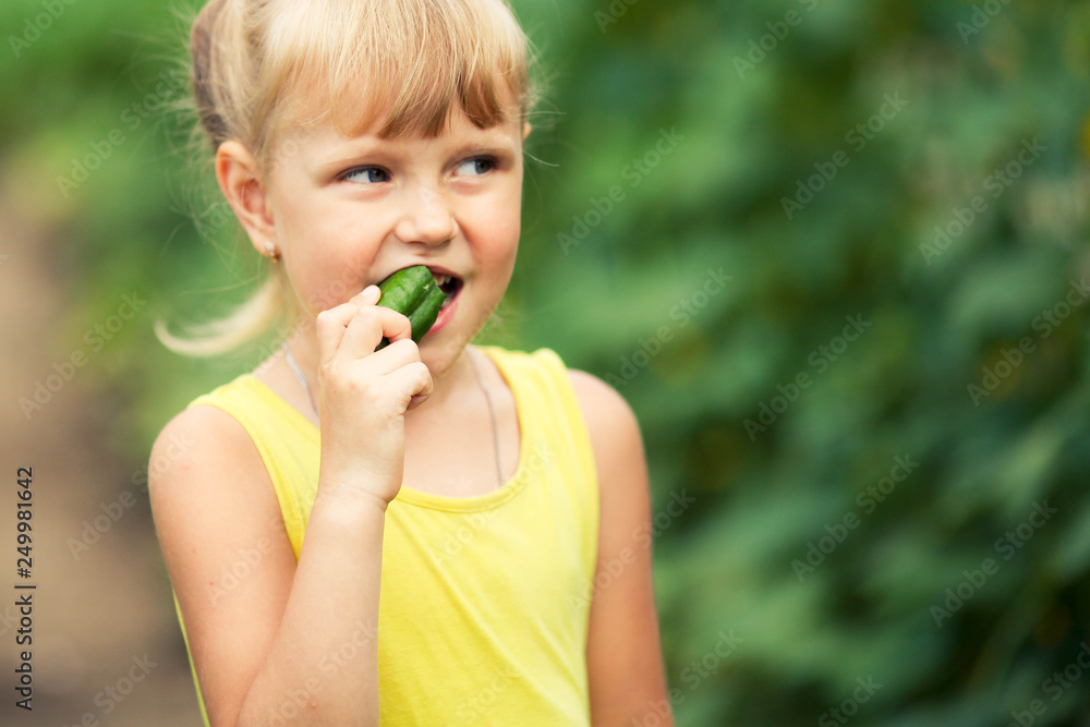 Portrait of a girl eating cucumber Portrait of a girl eating cucumber