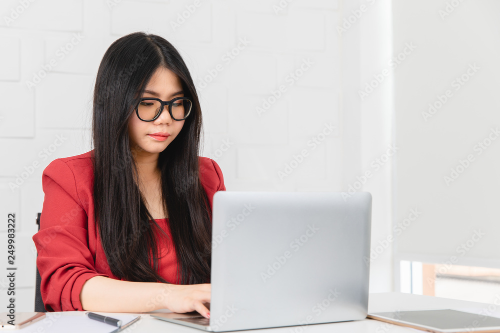 Business woman sitting and working with a notebook on the front. Business woman sitting and working with a notebook on the front.