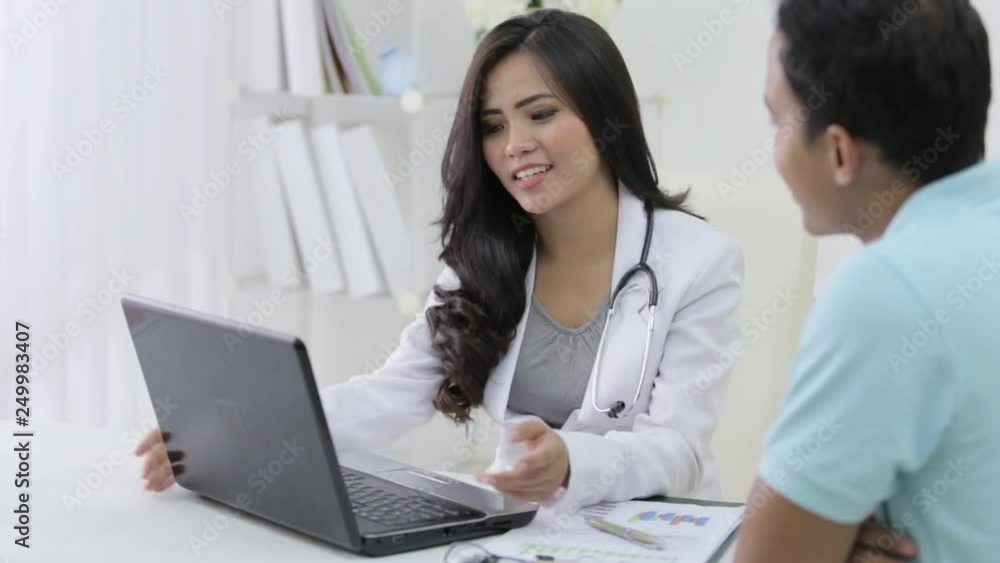 beautiful female doctor talk to her patient about some prescription beautiful female doctor talk to her patient about some prescription