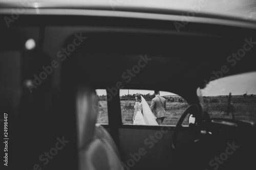 Caucasian happy romantic young couple celebrating their marriage. Outdoor