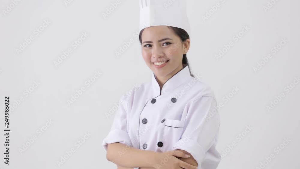 happy young female chef on white background showing thumb up happy young female chef on white background showing thumb up