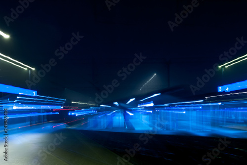 Abstract night scene of Kouvola railway station in zoom blur effect.