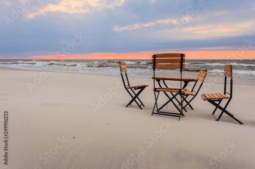 Relaxation place on sandy beach © Voyagerix