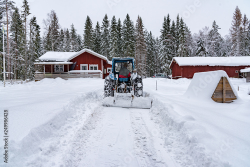 old blue fordson dexta tractor plowing snow © Jonas