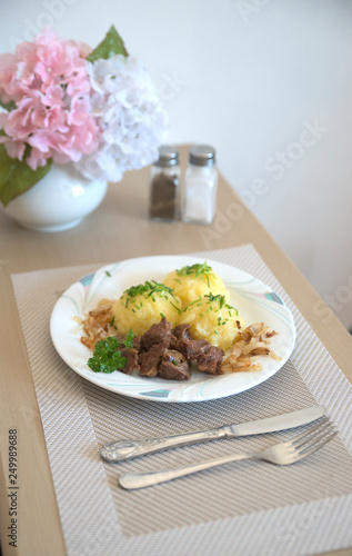 traditional Bavarian German food dumpling with red cabbage and mushrooms is tasty and appetizing in the kitchen photo