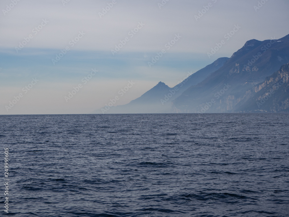 Landscape with deep blue water and mountains on the coast