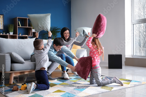 Family fighting pillows at ...