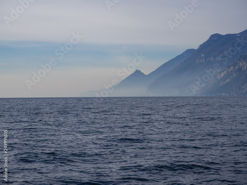 Landscape with deep blue water and mountains on the coast