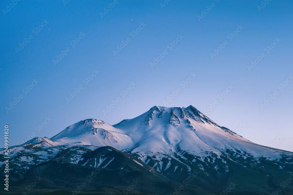 natural background with snow-covered volcano