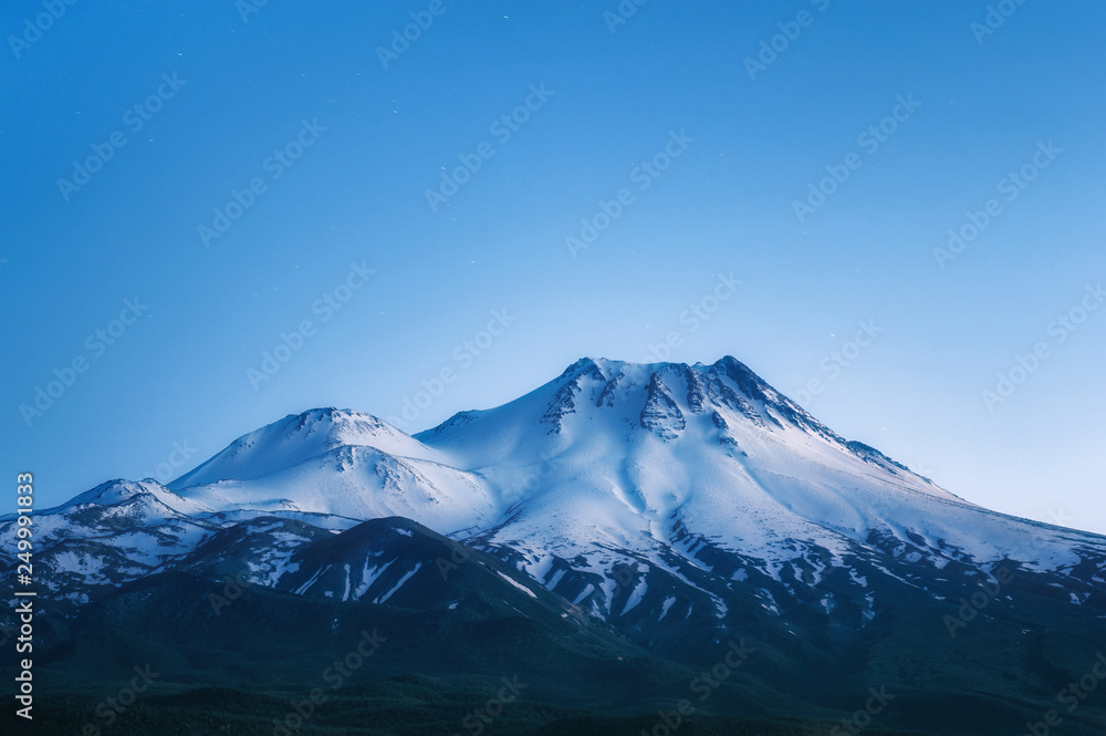 natural background with snow-covered volcano