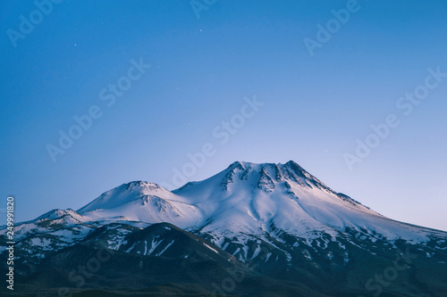 natural background with snow-covered volcano