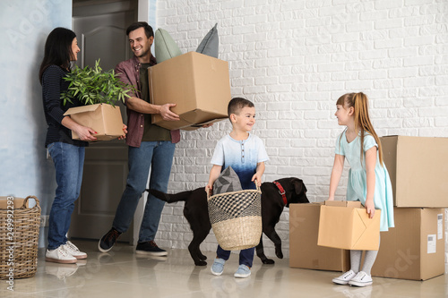 Family with cardboard boxes...