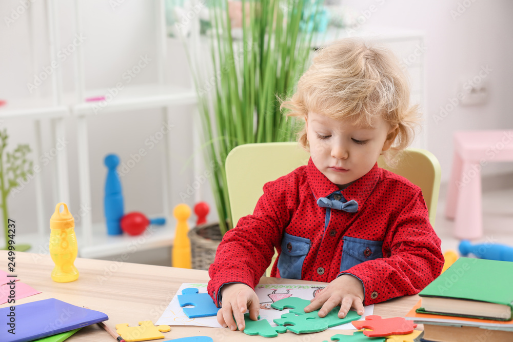 Cute little boy playing at home Cute little boy playing at home