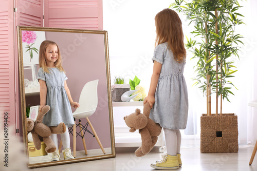 Cute little girl with teddy...