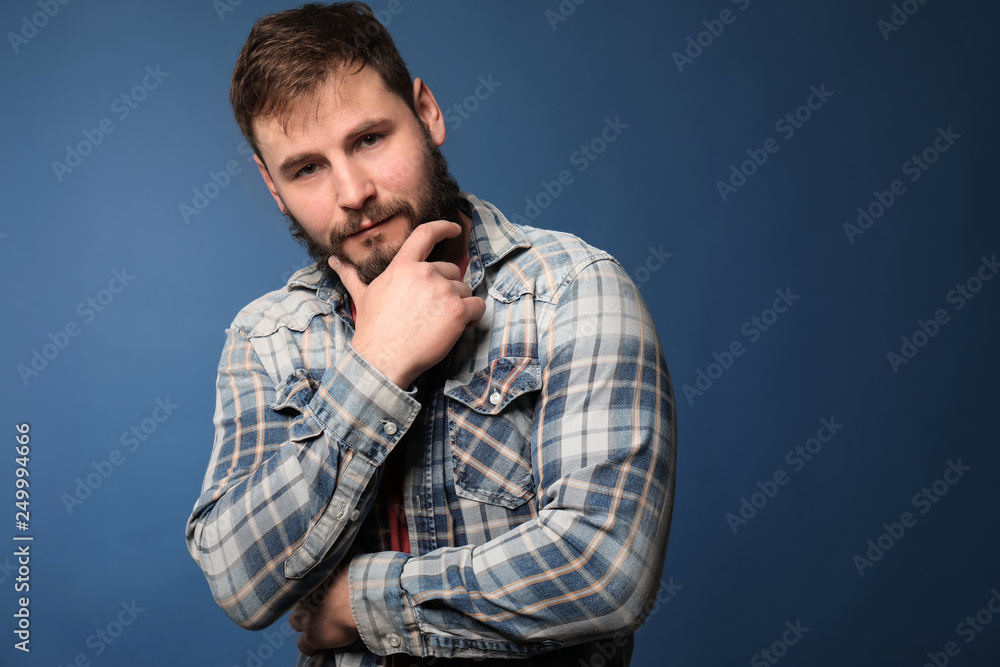 Bearded man in casual clothes on color background Bearded man in casual clothes on color background