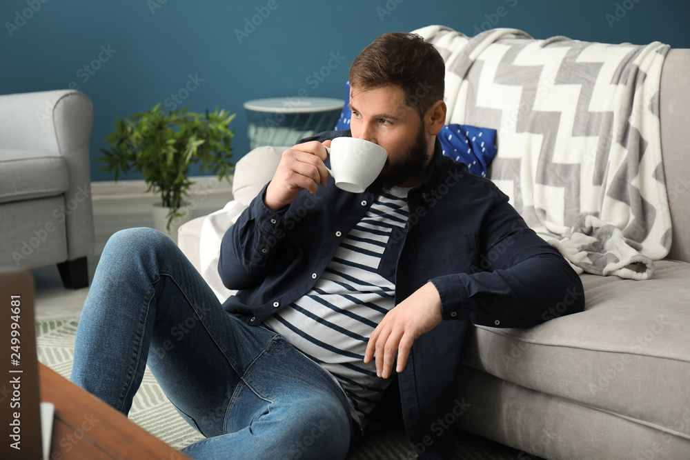 Bearded man drinking coffee at home Bearded man drinking coffee at home