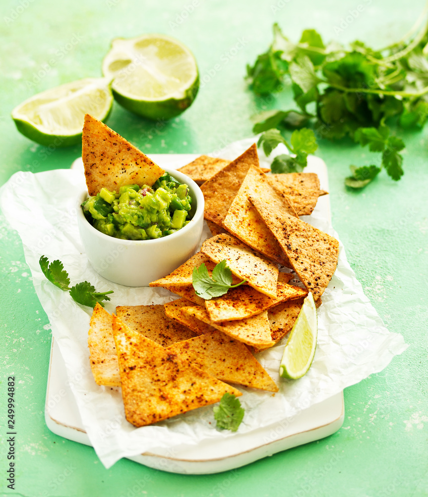 corn tortilla chips with guacamole dip.