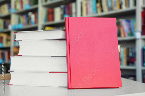 Many books on table in library