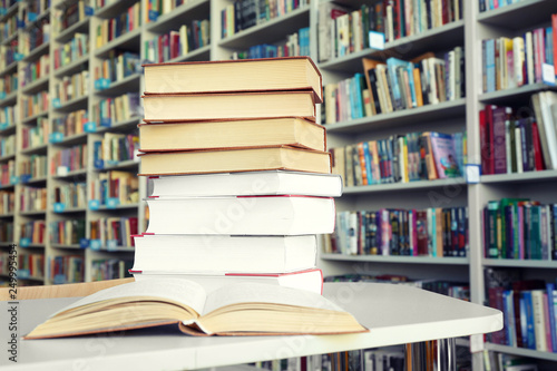 Many books on table in library