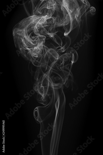 Fototapeta Naklejka Na Ścianę i Meble -  Movement of white smoke on black background for art design