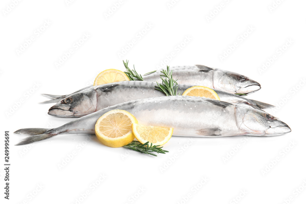 Tasty raw mackerel fish with rosemary and lemon on white background Tasty raw mackerel fish with rosemary and lemon on white background
