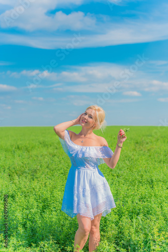 Woman on a nature, spring - summer season, concept of freedom life, lady in white linen dress 