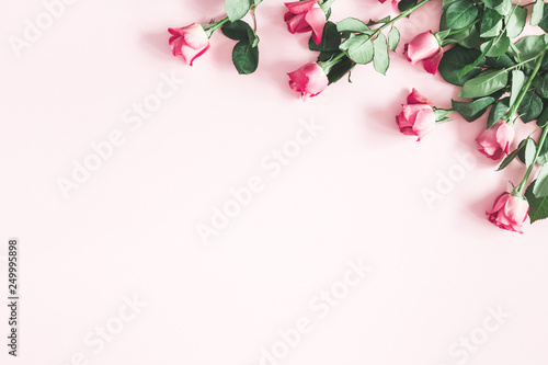 Flowers composition. Pink rose flowers on pastel pink background. Valentines day, mothers day, womens day concept. Flat lay, top view, copy space