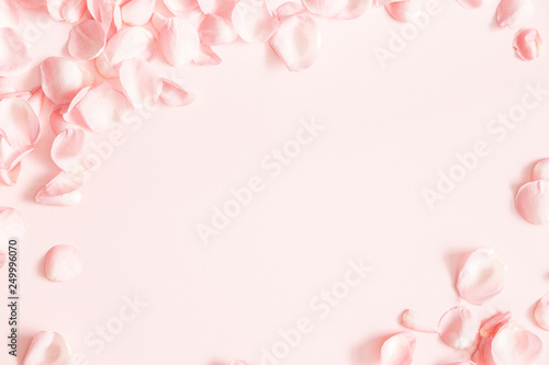 Fototapeta Naklejka Na Ścianę i Meble -  Flowers composition. Rose flower petals on pastel pink background. Valentines day, mothers day, womens day, wedding concept. Flat lay, top view, copy space