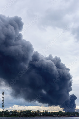 dangerous cloud of black smoke closeup as background.