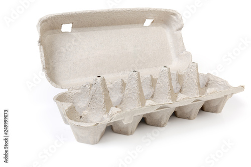 Open empty pulp egg carton on a white background