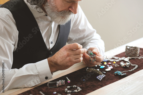 Jeweller making adornment i...