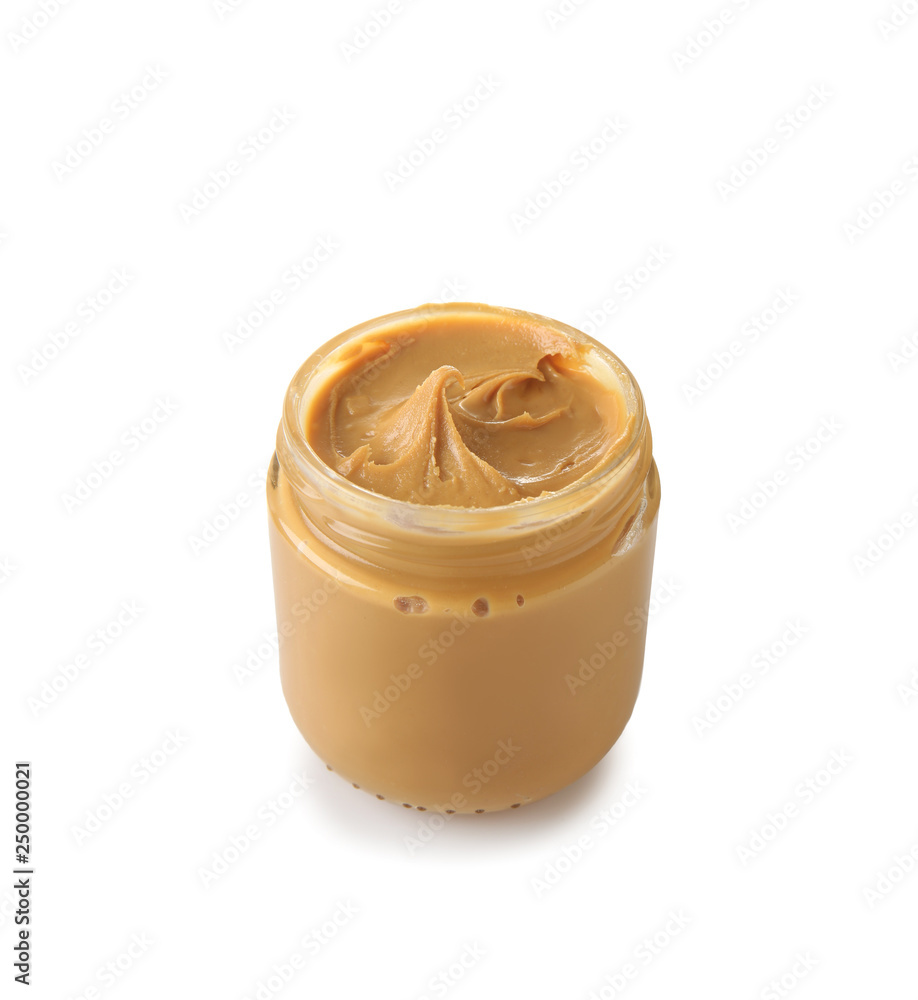 Tasty peanut butter in jar on white background Tasty peanut butter in jar on white background